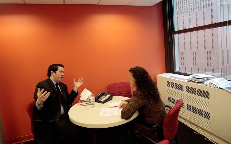 Two professionals meet, one with a pocketful of job interview tips sure to land him the job