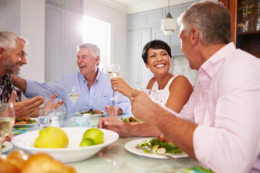 Mature Friends Enjoying Meal