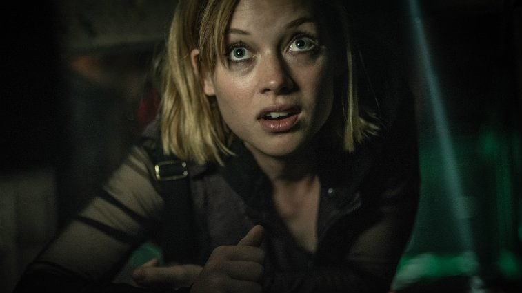 Jane Levy in Don't Breathe hiding on the floor looking terrified Jane Levy in Don't Breathe hiding on the floor looking terrified