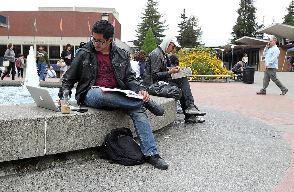 A UC Berkeley student works on his laptop