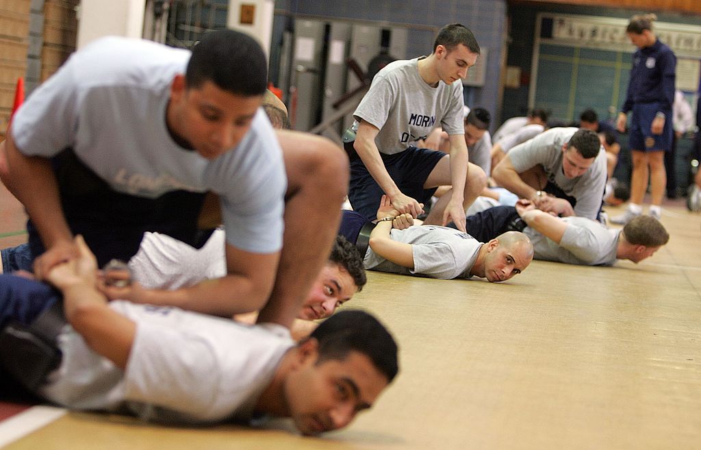 Recruits practice handcuffing techniques while training at the New York City Police Academy