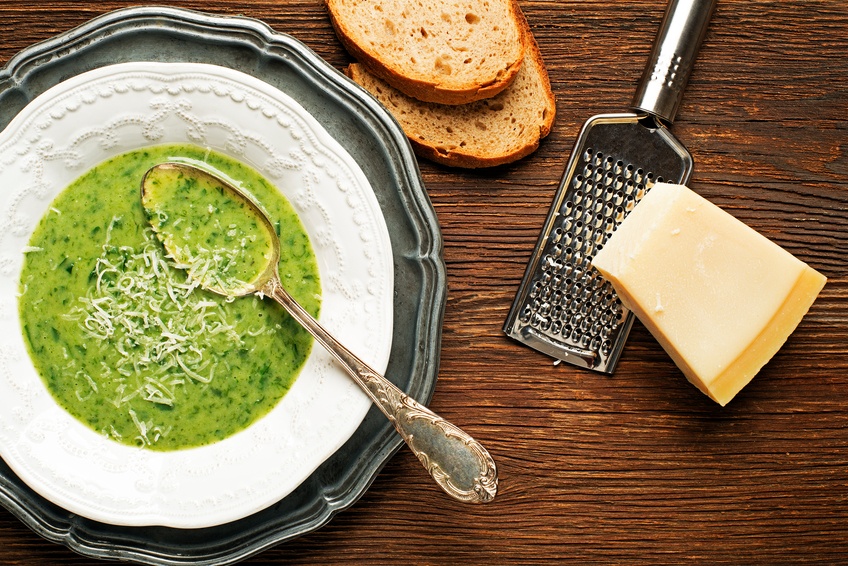 green soup on wooden background