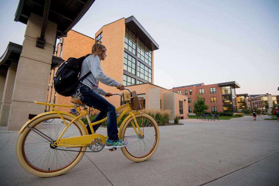 A student bikes to class at South Dakota State University