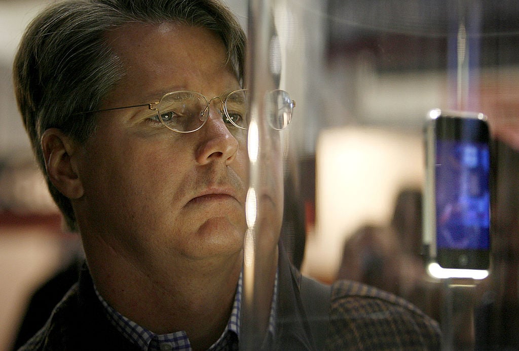 Mark Higbie of San Francisco looks at the first iPhone
