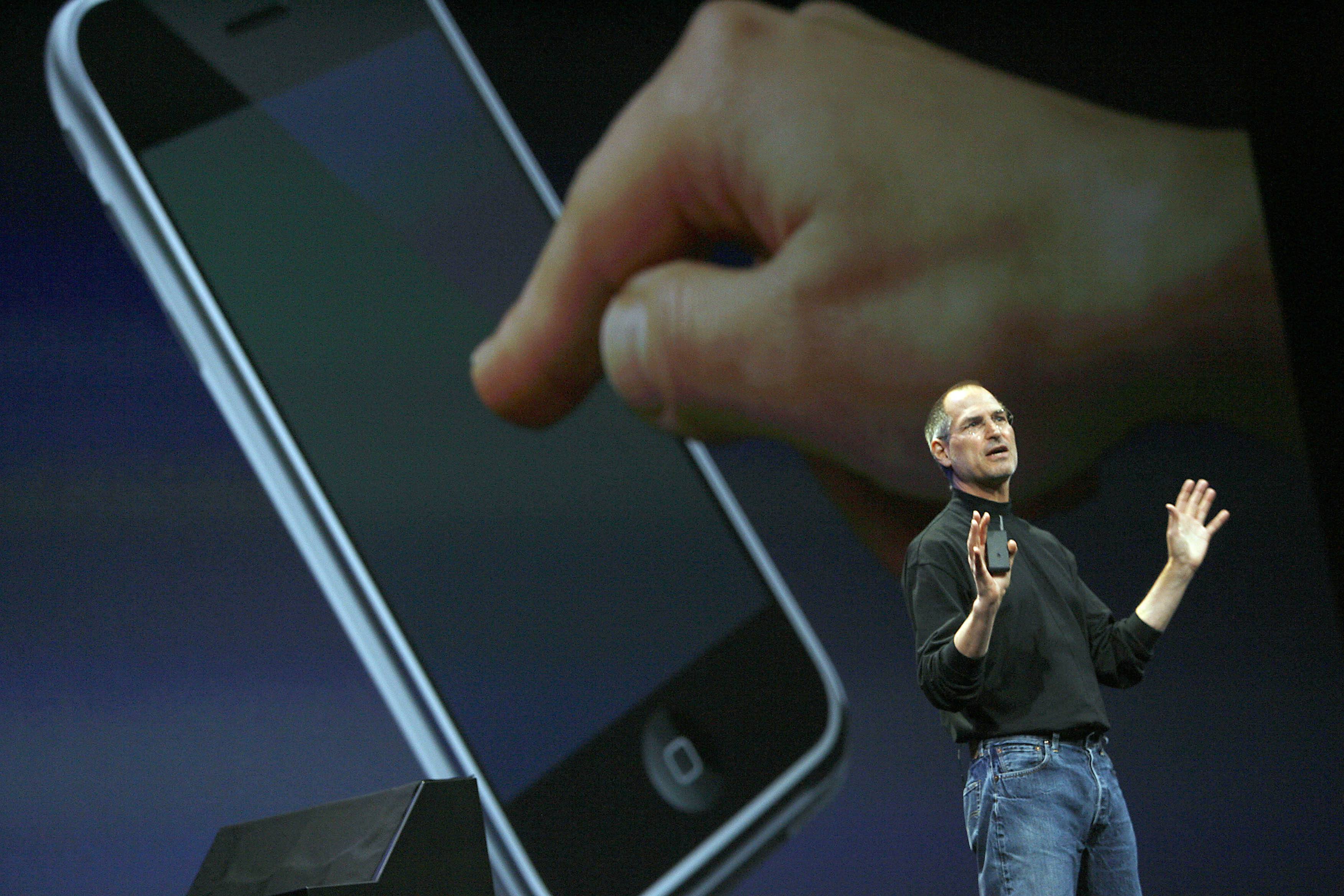 Apple chief executive Steve Jobs unveils a new mobile phone