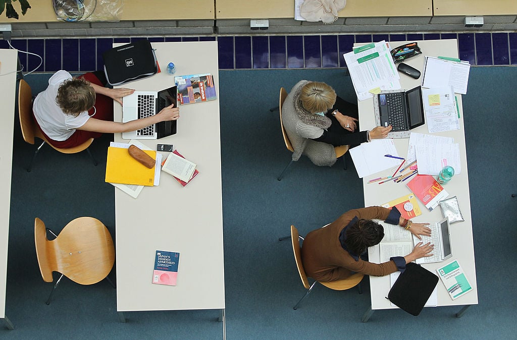 Students study with their laptop computers in the Pedagogical Library