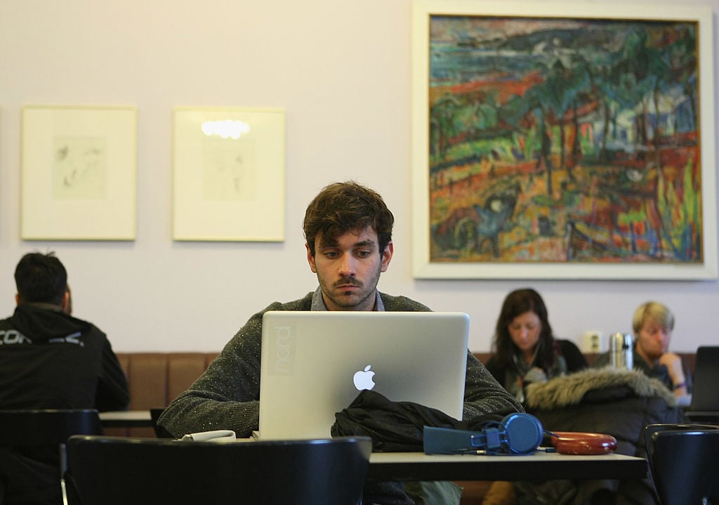 Student works on his laptop