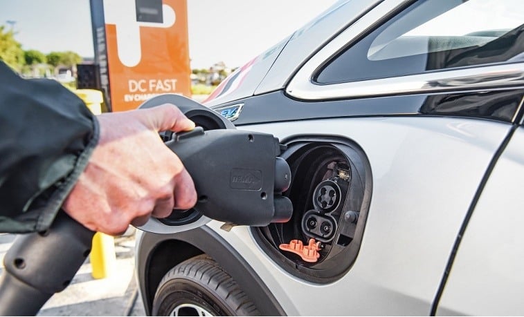 A silver 2017 Chevrolet Bolt EV stops for a charge