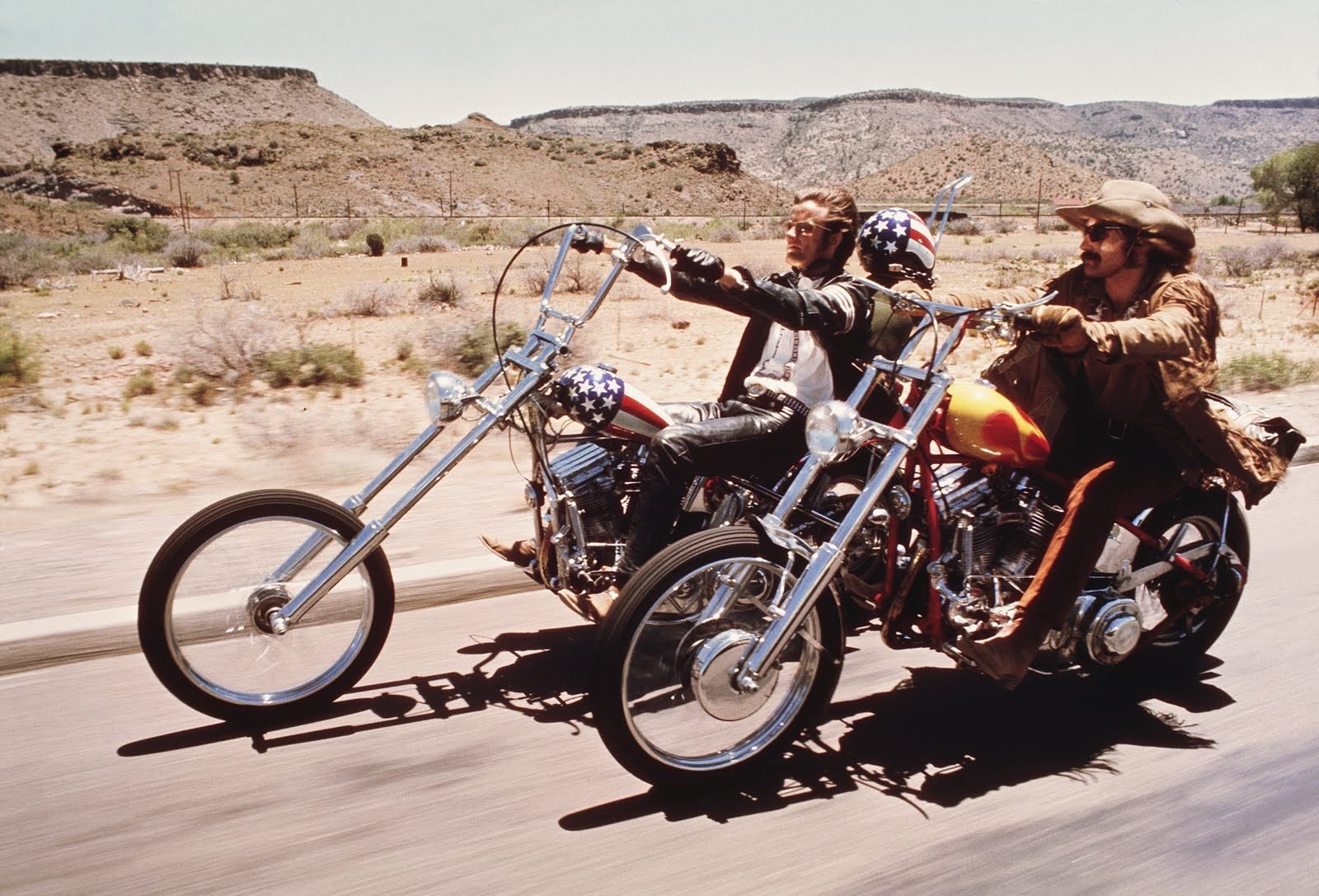 the cast of EAsy Rider on their motorcycles in the desert