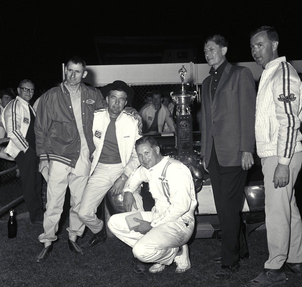 The Ford GT's first overall victory, 1965: (L to R) Ken Miles, Carroll Shelby, Lloyd Ruby, Leo Beebe, Ray Geddes. | Ford