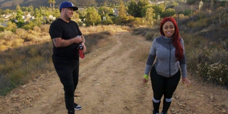 Rob Kardashian and Blac Chyna walk on a dirt road in Rob & Chyna 