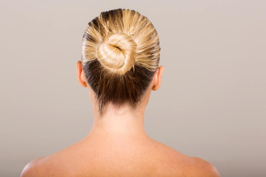young woman with hair bun
