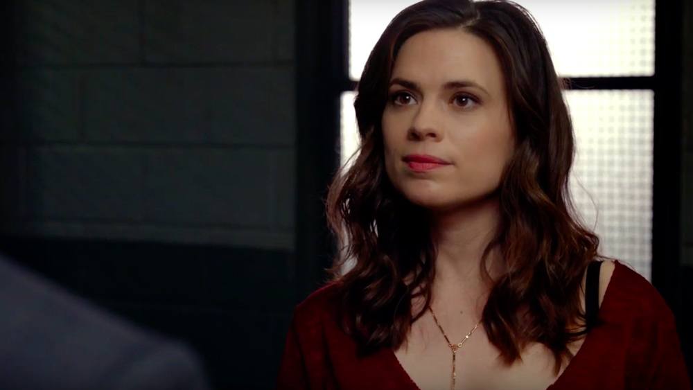 Hayley Atwell stands in front of a window in ABC's Conviction