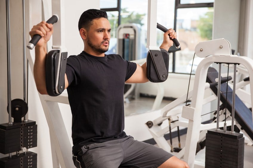 young man building muscle at the gym