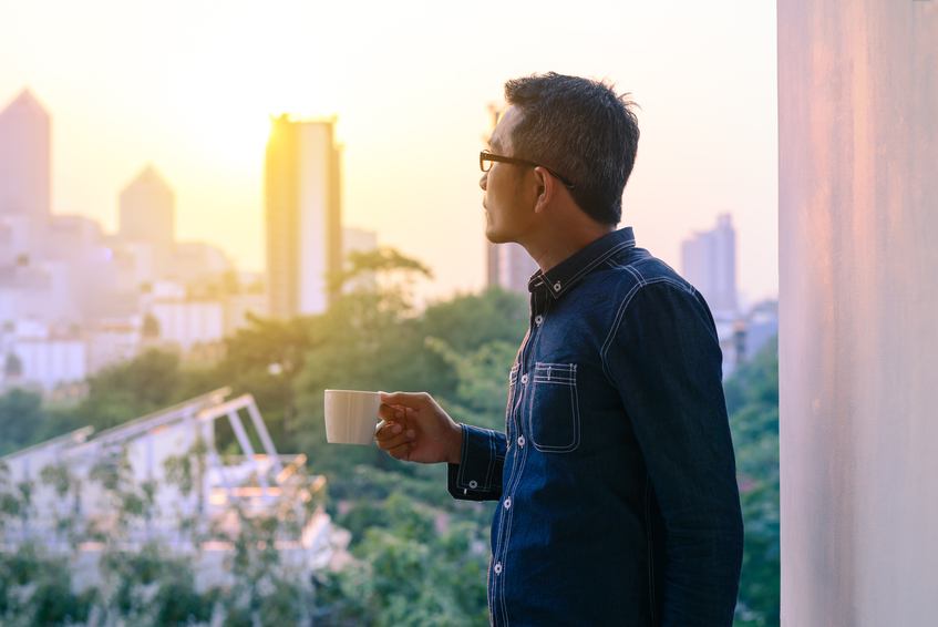 man in denim jacket and glasses
