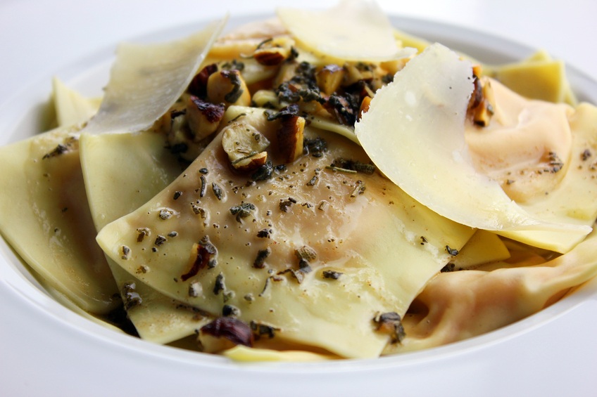 ravioli garnished with parmesan cheese