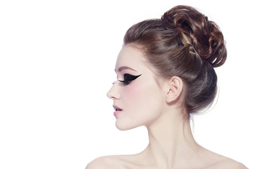 poartrait of young slim beautiful girl with hair bun