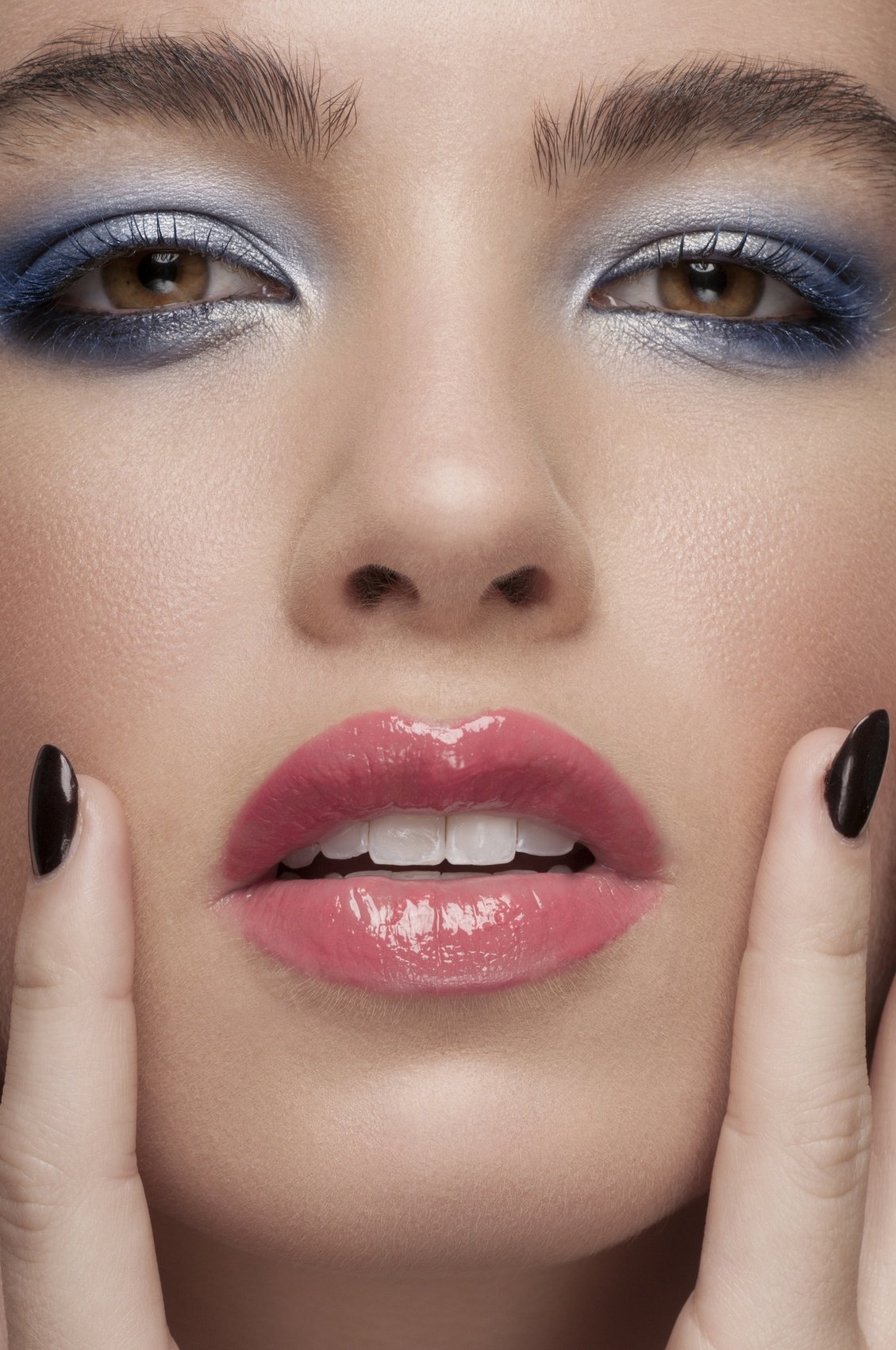 beauty close-up portrait of beautiful Caucasian woman in blue eye shadow
