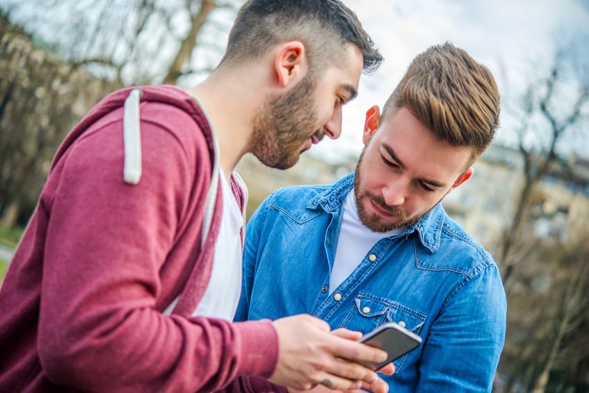 A couple looks at a smartphone