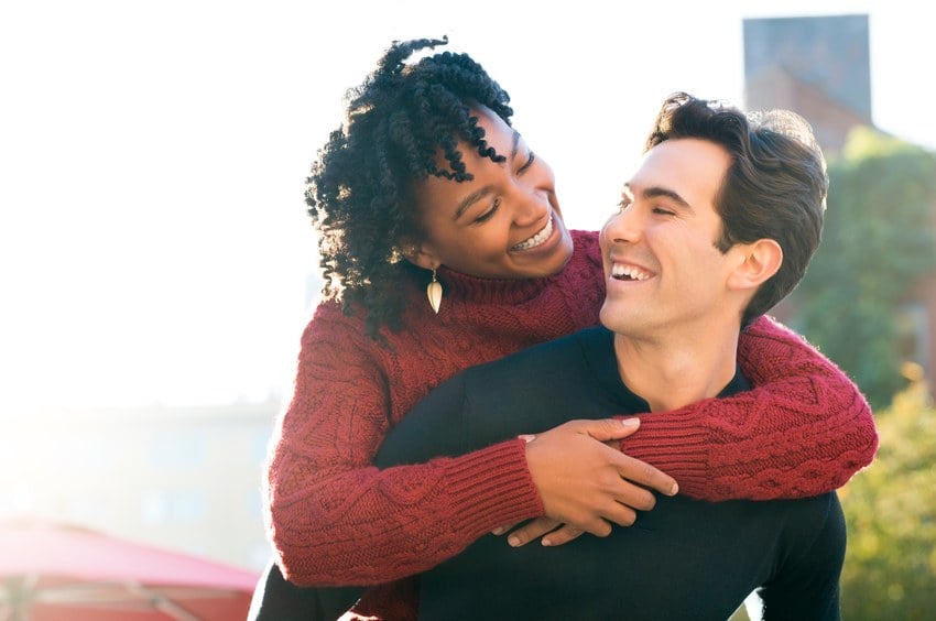 Portrait of a happy young couple enjoying outdoors
