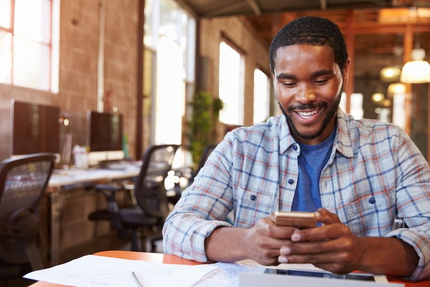 man sending a text