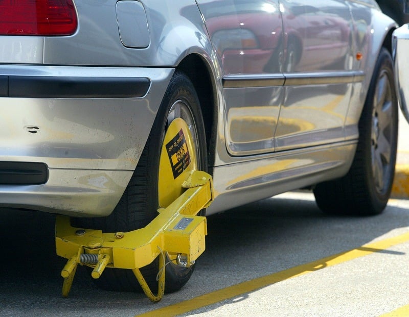 A parking boot, placed by enforcement officers