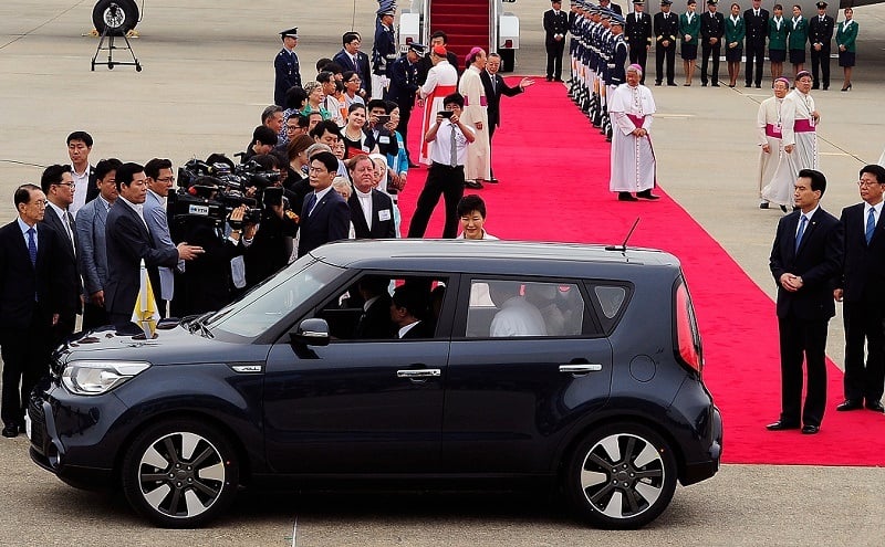 SEOUL, SOUTH KOREA - AUGUST 14: Pope Francis (inside a car) arrives at Seoul military airport on August 14, 2014 in Seoul, South Korea. Pope Francis is visiting South Korea from August 14 to August 18. This trip is the third trip abroad for the pope following Brazil and the Middle East. This is the third pontifical visit to South Korea. (Photo by Song Kyung-Seok-Pool/Getty Images)