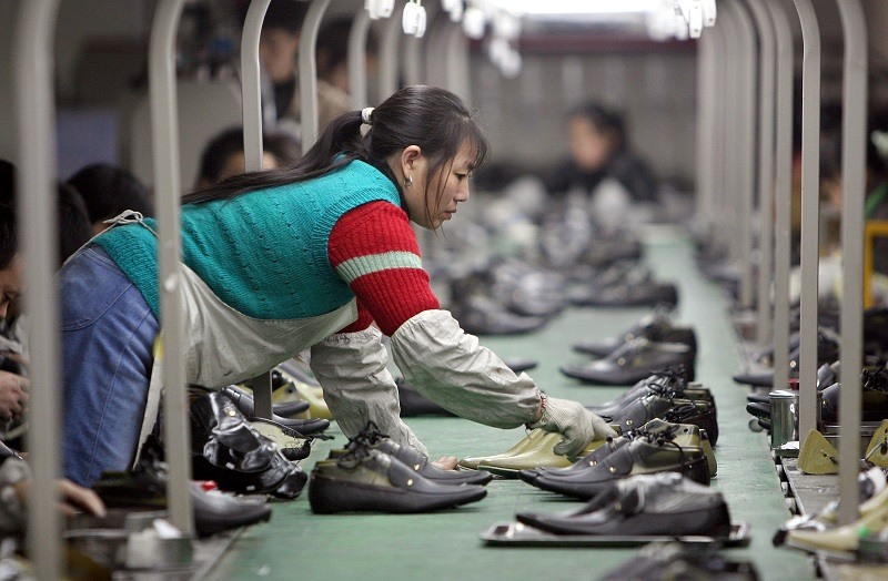 A Chinese worker in a shoe factory