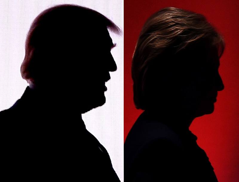 The silhouettes of then-Republican presidential nominees Donald Trump and then-Democratic presidential nominee Hillary Clinton