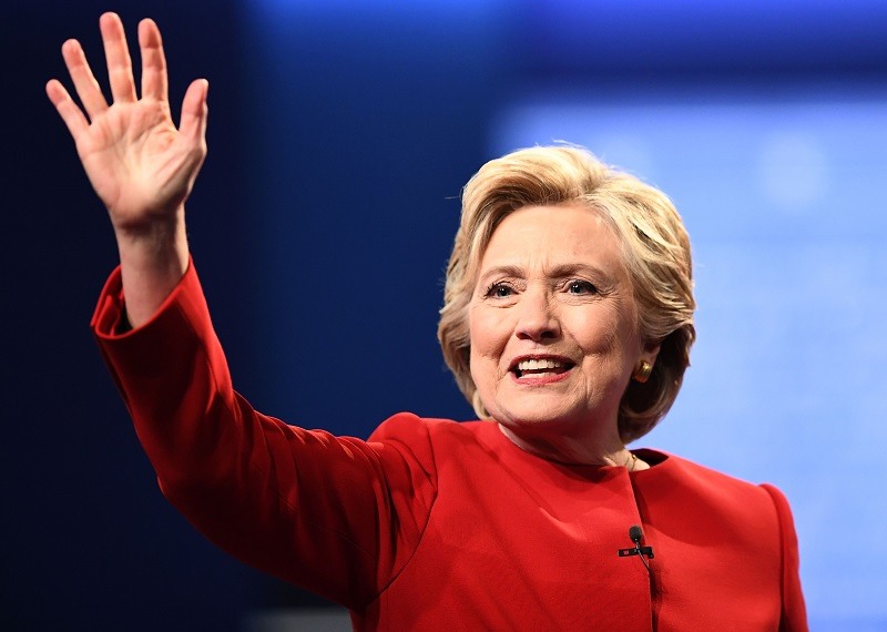 Democratic nominee Hillary Clinton waves after the first presidential debate at Hofstra University