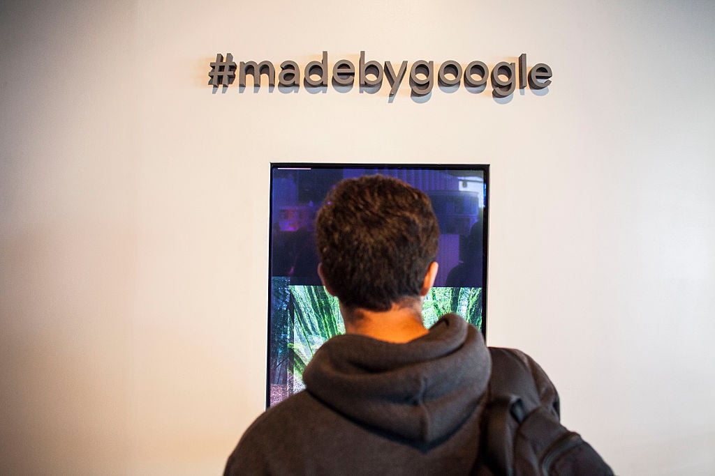 Members of the media examine Google's Pixel phone