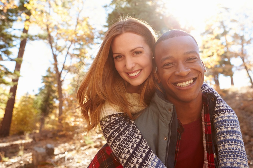 mixed race couple going for a hike mixed race couple going for a hike