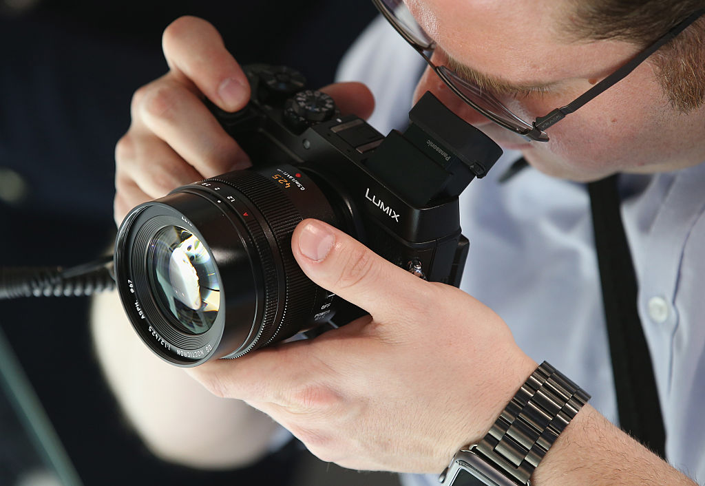 A visitor tries out the Lumix DMC-GX8 digital camera