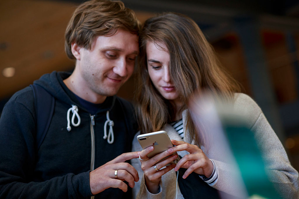 Customers check a new Iphone 7 exhibited at Puerta del Sol Apple Store