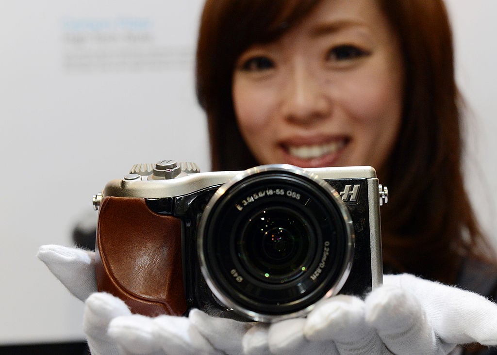 A model poses with Hasselblad's Lunar digital camera digital camera
