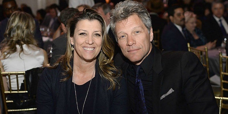 Jon Bon Jovi poses with Dorothea as they are sitting down next to each other. Jon Bon Jovi poses with Dorothea as they are sitting down next to each other.