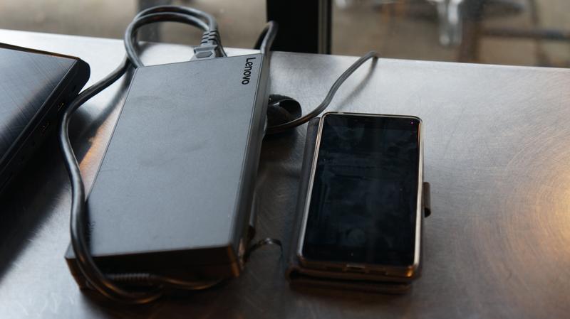 Ideapad Y900 power brick next to a phone