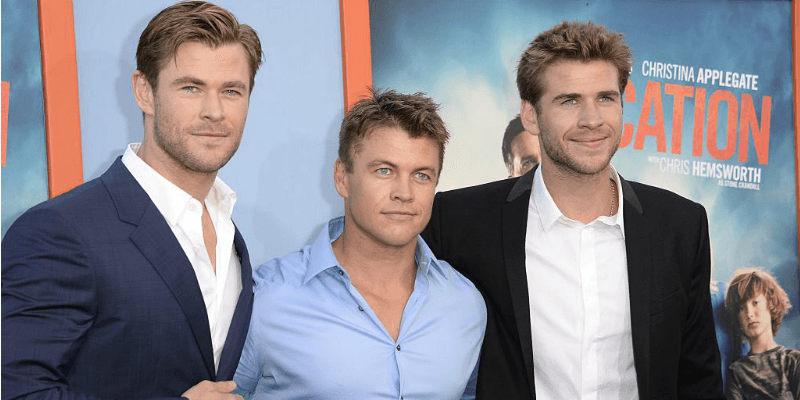 Liam, Luke, and Chris Hemsworth at a movie premiere