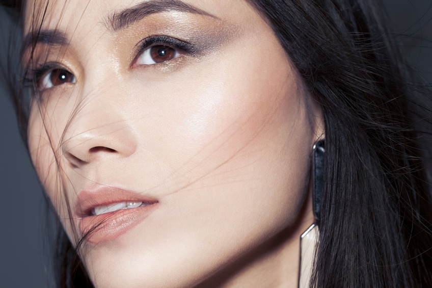 beautiful Asian woman with metallic smoky eyeshadow