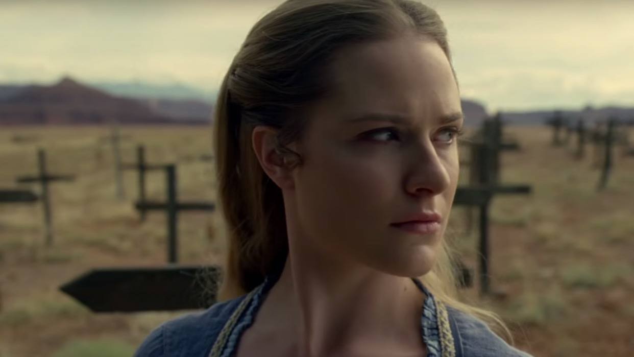 Dolores standing in a graveyard. Dolores standing in a graveyard.