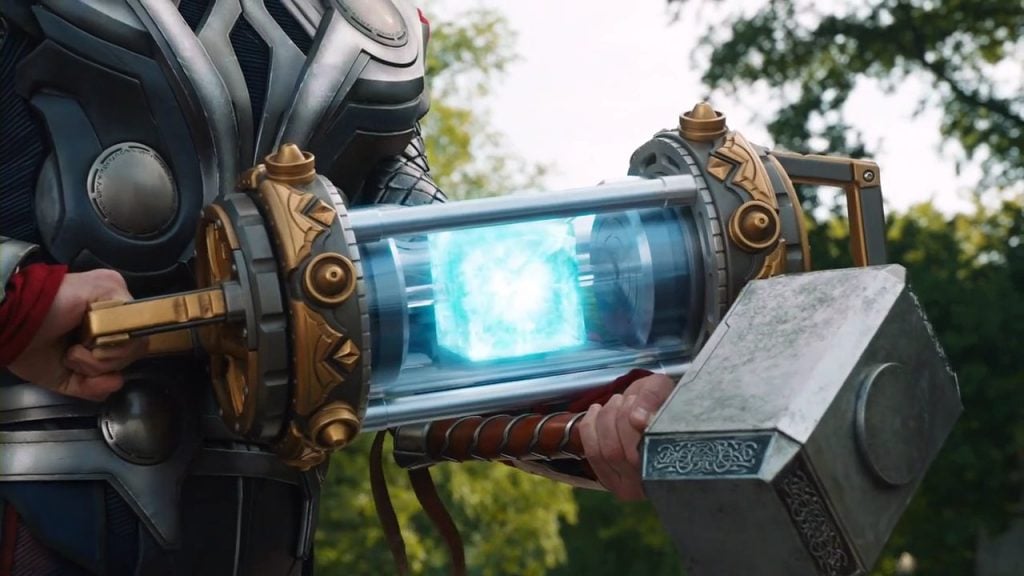 Thor holding the Tesseract in a glowing blue case