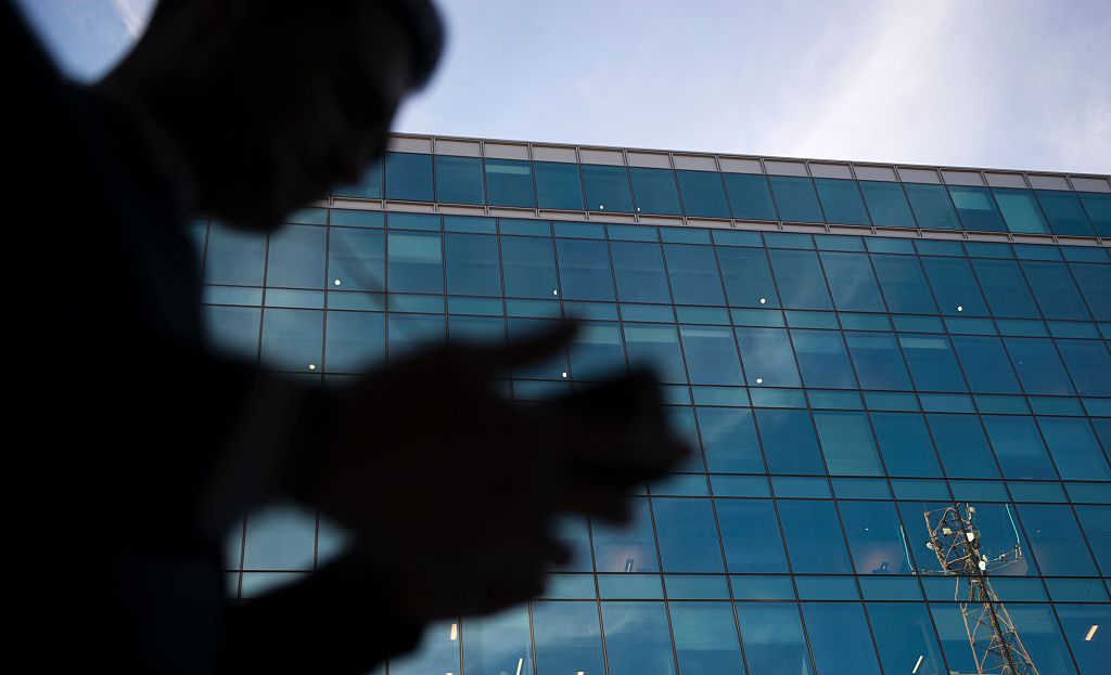A businessman talks on his cell phone