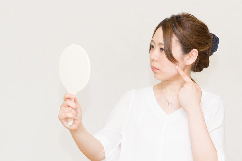 Woman looking in the mirror