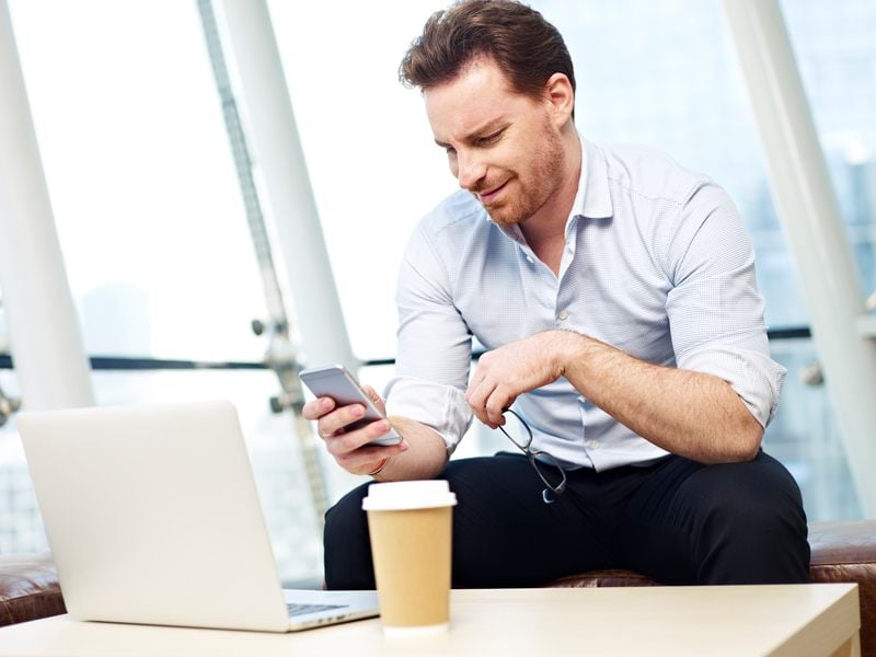 business man reading on his mobile phone