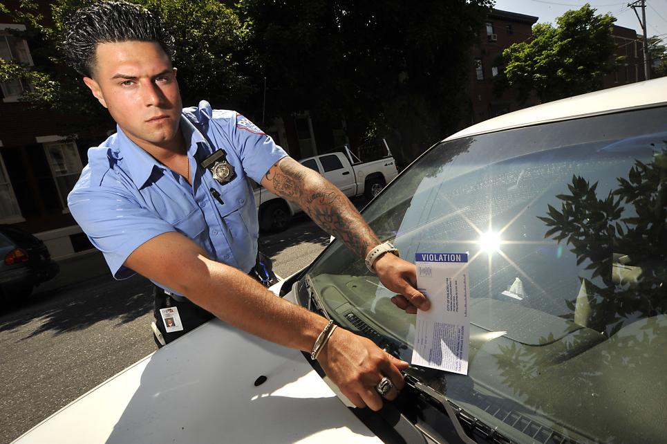 A member of the Parking Wars cast and parking enforcement officer
