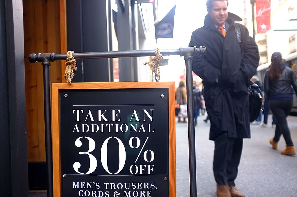 Markdowns are advertised at a discount clothing store