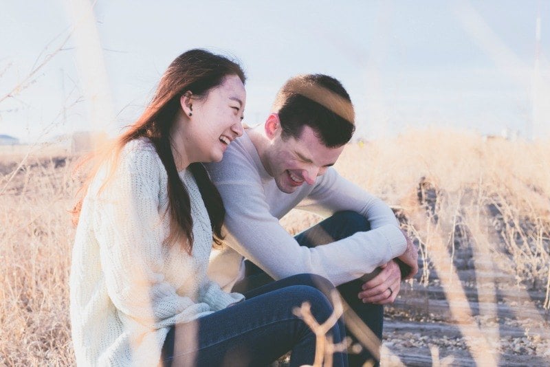 couple laughing outside