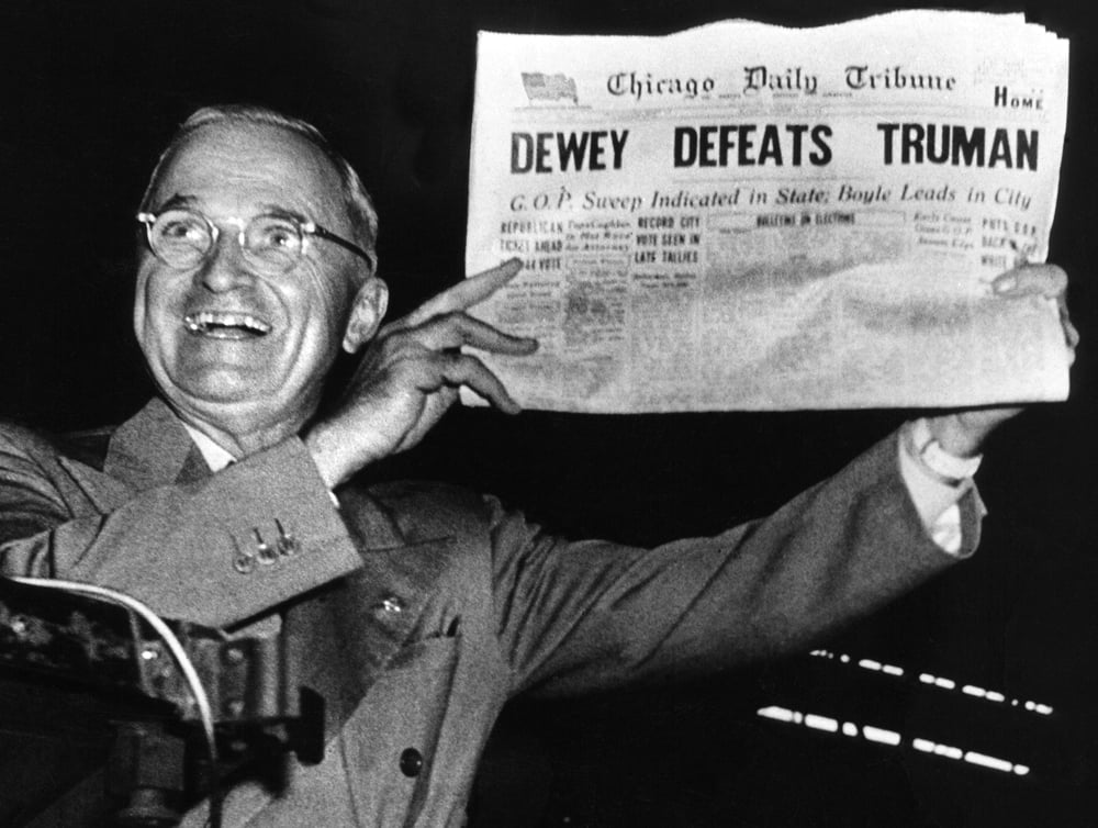 Truman holding an article titled 'Dewey Defeats Truman'