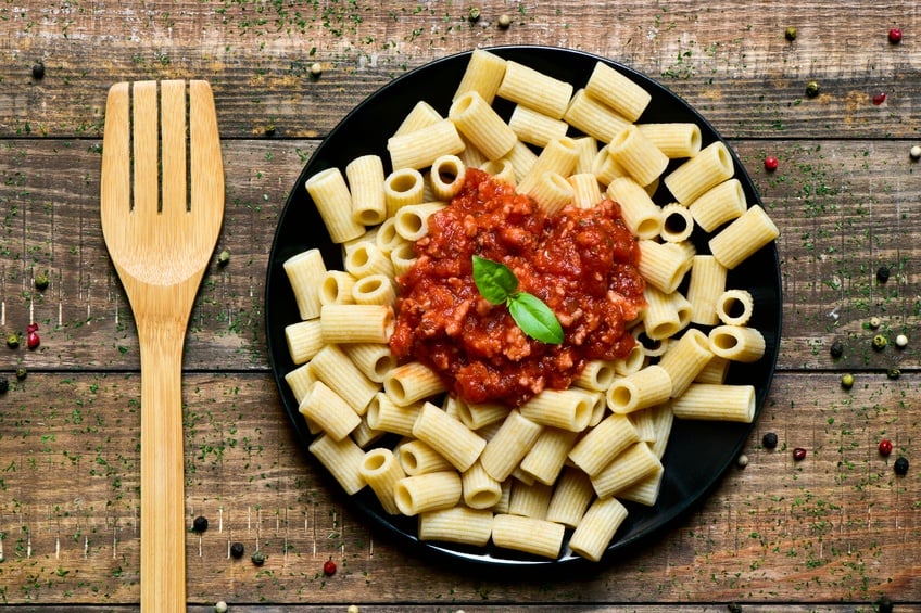 penne rigate with bolognese sauce and wooden fork penne rigate with bolognese sauce and wooden fork