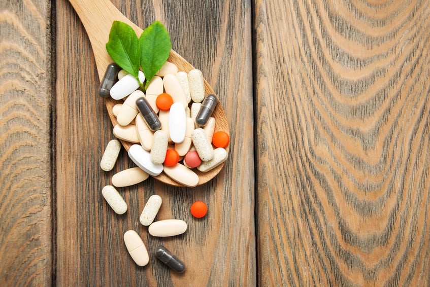 pills on spoon with leaves pills on spoon with leaves